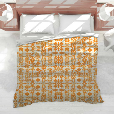 Édredon orange à motif damassé
