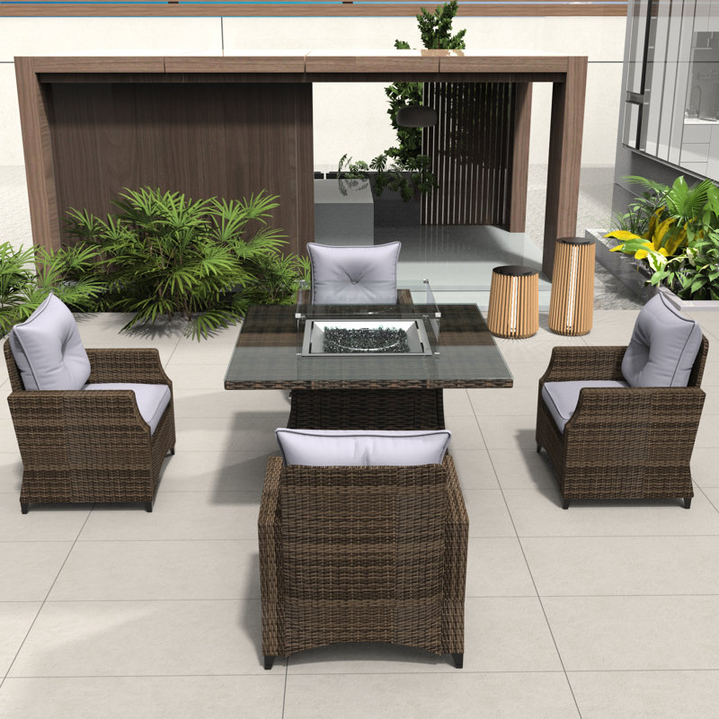 Schwerin Wicker 4 - Person Patio Conversation Set with Cushions