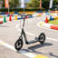 Scooter en acier noir mat pour les enfants de 5 à 12 ans avec guidon réglable et 12 grandes roues