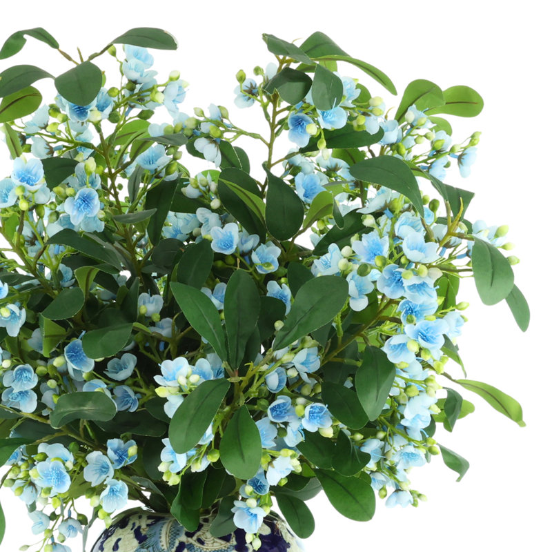 Tiges en herbe dans un vase décoratif, Bleu