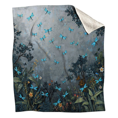 Libellules bleues dans des couvertures de jardin