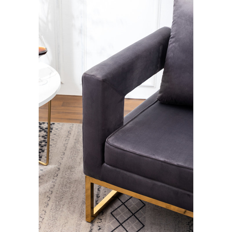 Fauteuil gris contemporain - Style avec assise rembourrée, structure en métal, dossier carré, accoudoirs confortables et revêtement en tissu doux effet velours, pour une détente optimale.