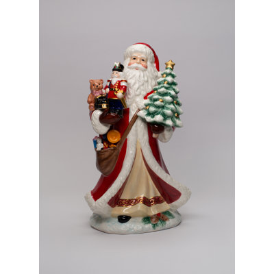 Figurine de père Noël tenant des jouets