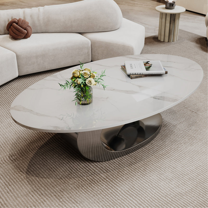 Table basse en marbre avec base sculpturale en acier inoxydable