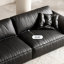 Causeuse-coussin modulable noire en cuir véritable-23077328