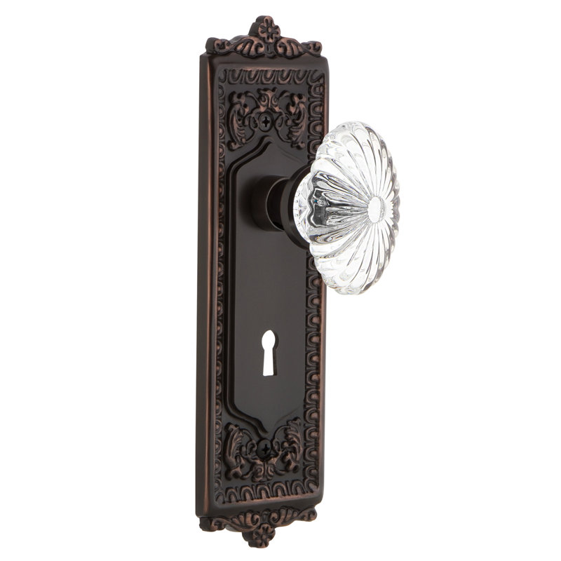 Egg & Dart Plate avec trou de serrure décoratif et bouton de porte ovale en cristal cannelé, Bronze intemporel, 2 3/8 po