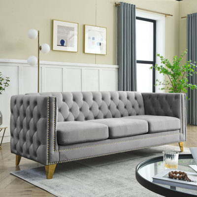 Velours gris: bouton, accoudoir carré, structure en métal Pièce de salon moderne: boutons, accoudoirs, base