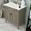 Meuble-lavabo autoportant élégant avec lavabo en céramique brillante, portes à fermeture douce et tablette réglable