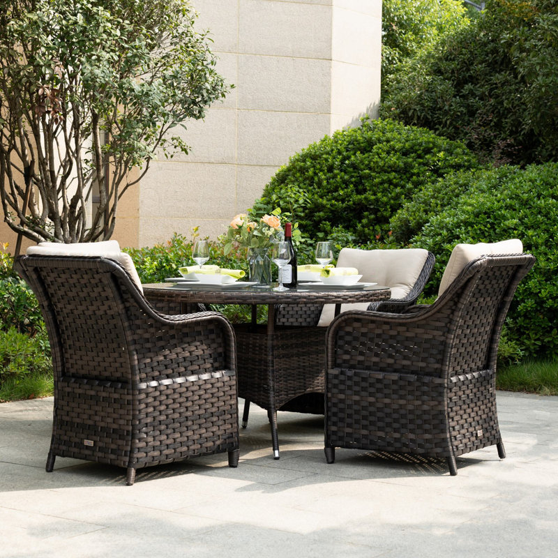 Ensemble repas pour 4 personnes en osier avec table ronde Guyer, coussins inclus