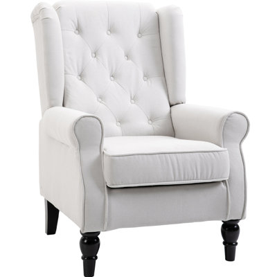 Fauteuil en bouton blanc crème. Haut et rembourré. Coussin d'assise épais. Convient au salon, à la chambre ou au bureau. Structure en bois massif et pieds en eucalyptus. Épaisseur : 15 cm. Profondeur du siège : 53 cm ; largeur du siège : 48 cm. Charge maximale : 160 kg.
