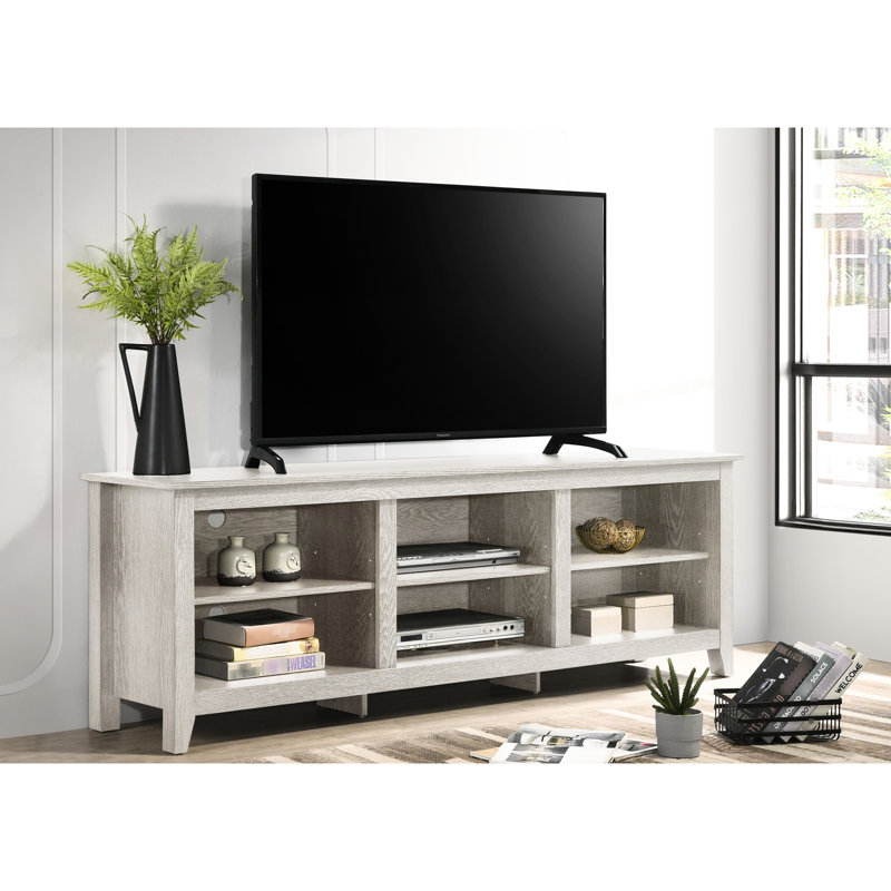 Meuble télé gris à panneau de particules, capacité de 70 à 79 pouces, conception de tablette ouverte, gestion des câbles, pieds multiples, tablettes réglables, 6 découpes, plateau de table gris de 0,59 po, plateau de jeu, hauteur des pieds 2,75 po, tablettes en H 7 po
