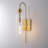 Dimmable Armed Wall Sconce with Clear Glass Shade