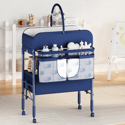 Table à langer pliante portable avec tiroirs et roues, hauteur réglable à 4 niveaux, organisateur de chambre de bébé mobile avec coussin imperméable et règle de croissance, bleu