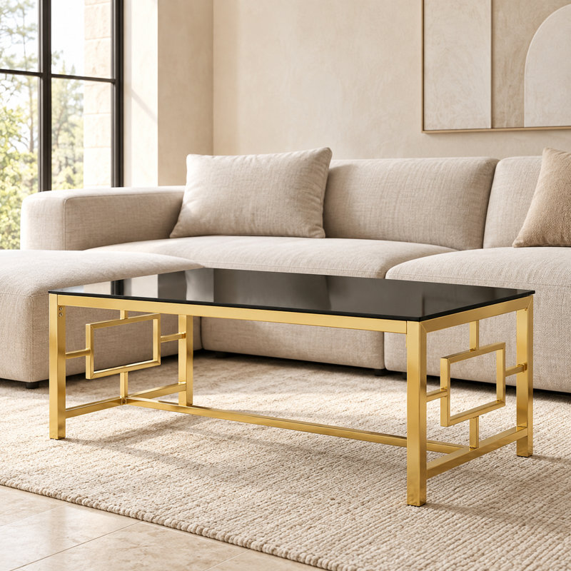 Table basse rectangulaire moderne avec dessus en verre trempé et structure métallique géométrique imbriquée, table basse élégante et robuste
