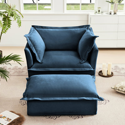 Fauteuil en chenille bleue avec housses spacieuses, confortables et lavables, structure en chenille, assise profonde, coussins élégants et assise en bois robuste amovible.