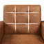 Fauteuil moderne en similicuir capitonné-277769038