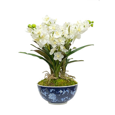 Roses And Eucalyptus In A Green And White Vase