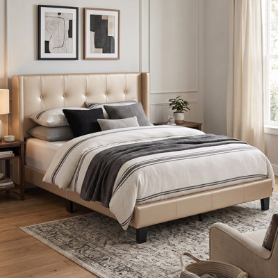 Arshaun Upholstered Faux Leather Wingback Bed