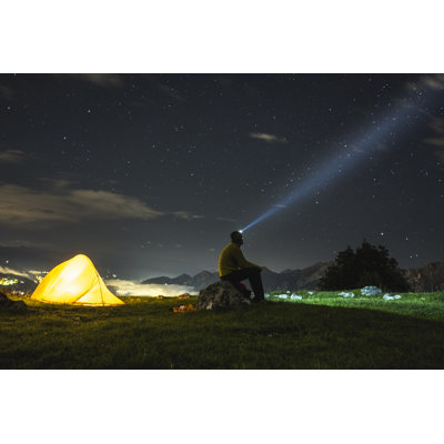Hiker Camping at Night by Deimagine