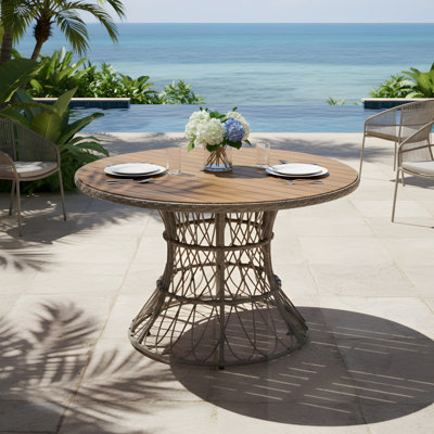 Table de salle à manger d'extérieur ronde avec base en osier