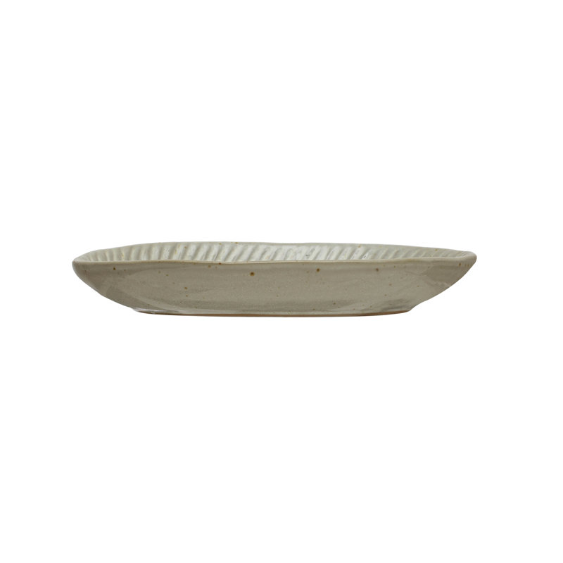 Debossed Stoneware Plate In White Reactive Glaze