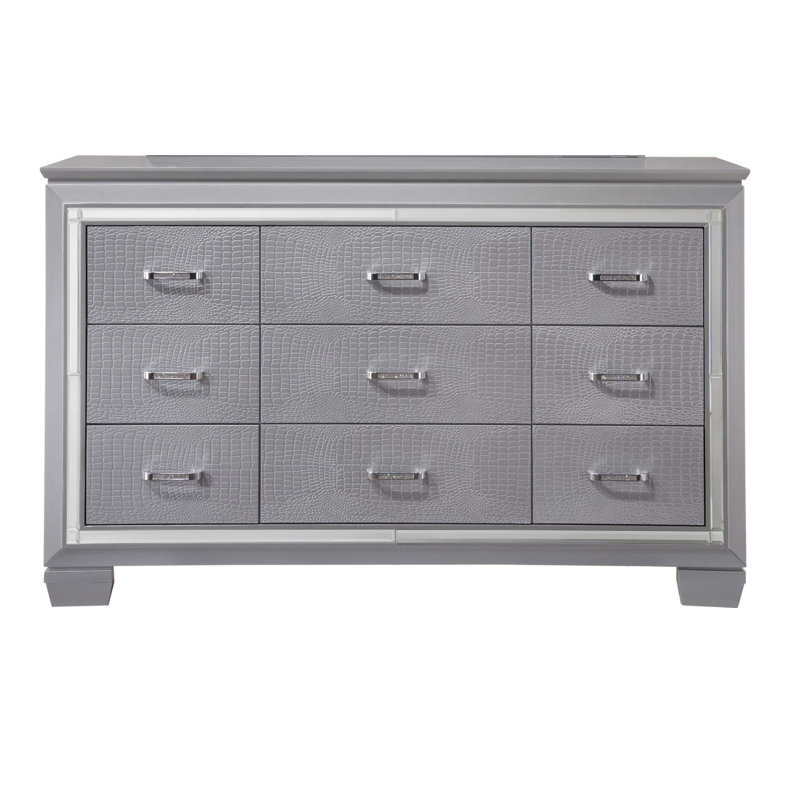 Commode moderne à neuf tiroirs avec détails en faux cristal et miroir biseauté, quincaillerie chromée pour un rangement élégant