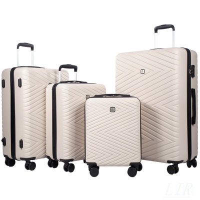 Ensemble de 4 valises en ABS léger avec roues rotatives et verrous TSA, idéal pour le transport et le rangement en blanc