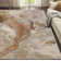 Abstract Machine Woven Marble Mocha Swirl Polypropylene Area Rug in Beige