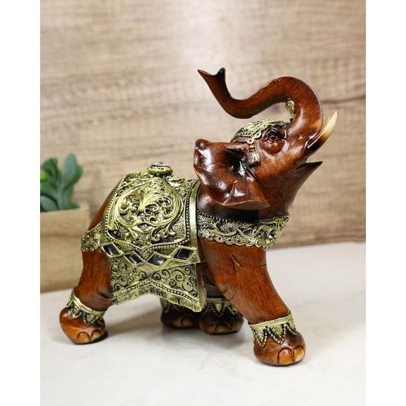Figurine éléphant en faux bois avec volutes dorées et miroirs en verre