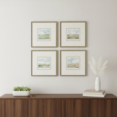 Ensemble de quatre impressions sur toile encadrées dorées