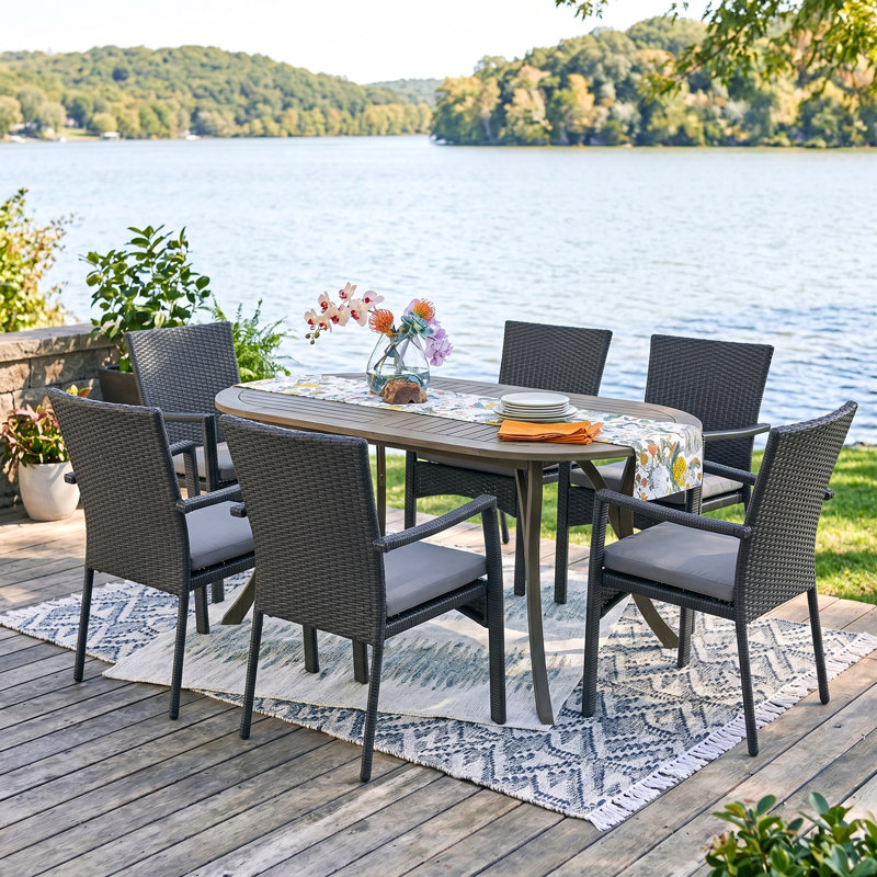 Eliger 6 - Person Acacia Wicker Patio Dining Set with Oval Table , Cushions Included