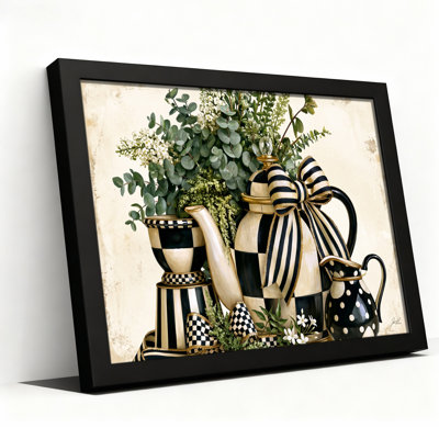 Tableau sur toile représentant des théières à carreaux et à rayures noirs et blancs avec de la verdure