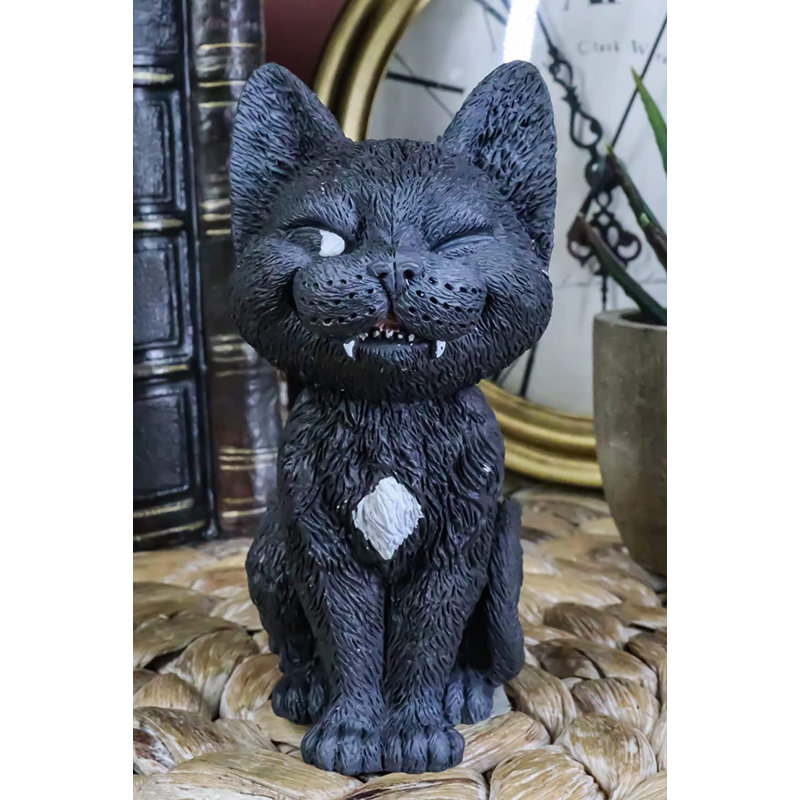Statue de chat sinistre souriant félin