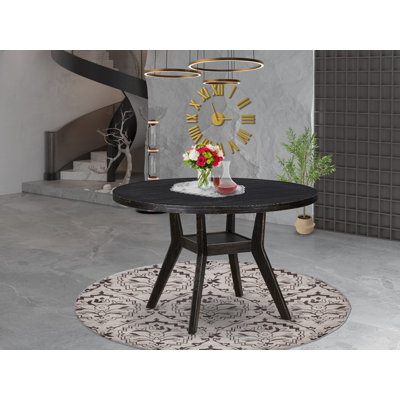 A Wooden dining table with a Round Tabletop and Stylish Pedestal, Sand Blasted Black Finish.
