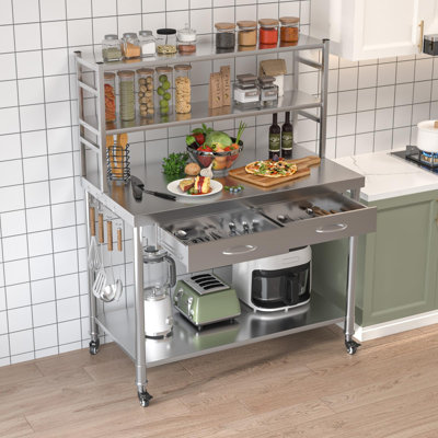 Table en acier inoxydable avec tablettes et tiroir