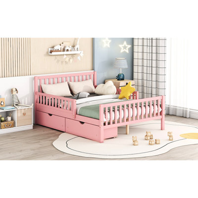 Lit plateforme en bois rose avec garde-corps à chutes et rangement pleine grandeur et utilitaire