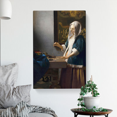Woman Holding a Balance by Johannes Vermeer - Wrapped Canvas