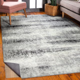 Everist Rectangle Abstract Machine Woven Polypropylene Area Rug in Grey with Rug Pad Included