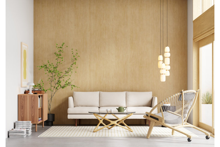 Modern living room with a light wood paneled accent wall, a beige sofa, and light wood accent furniture.