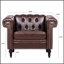 Canapé élégant avec cuir souple, garniture cloutée argentée et coussins confortables pour une détente ultime dans les salons.-1271706140