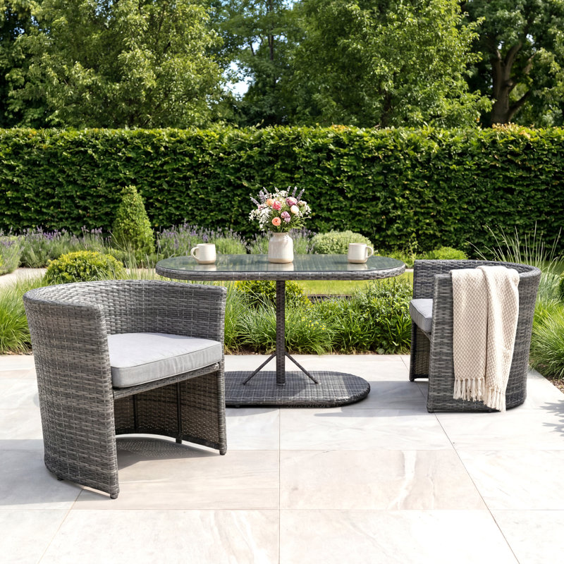 St Tropez 2 - Person Wicker Patio Dining Set with Oval Table , Cushions Included