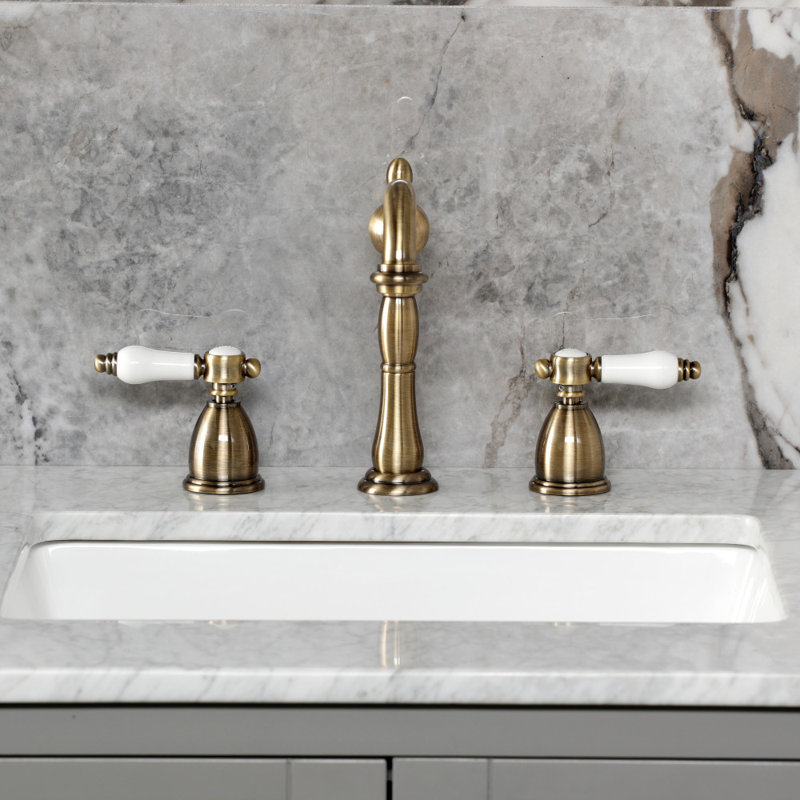 Kingston Brass Bel-Air Two-Handle 3-Hole Deck Mount Widespread Bathroom Faucet with Pop-Up Drain, Antique Brass