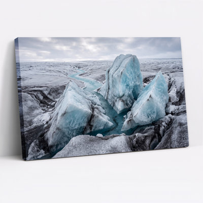 Jagged Blue Glacial Ice Formations in Turquoise Stream Canvas Wall Art