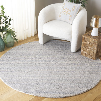Tapis bleu / gris touffeté à la main