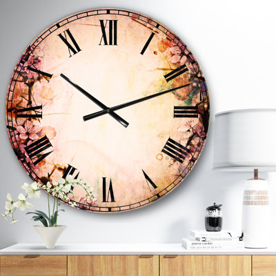 Sakura rose sur fond flou - horloge murale traditionnelle