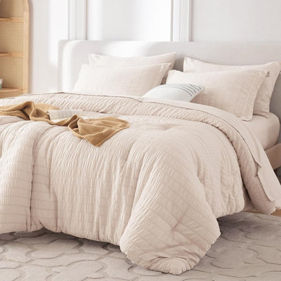 Ensemble d'édredon grand beige en seersucker 7 pièces dans un sac de luxe avec édredon toutes saisons, draps, taies d'oreiller et taies décoratives