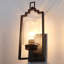 Applique murale d'extérieur moderne moderne en métal noir mat avec abat-jour en verre transparent fabriqué à la main