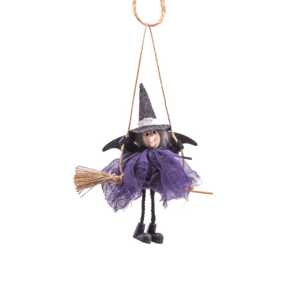 The Holiday Aisle® Violet Cloth Hanging Witch resting on Broomstick ...