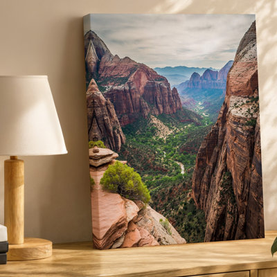 Canvas A Breathtaking View Of A Rugged Canyon Landscape Showcasing Towering Wall Art Cliffs Of Reddish Brown Rock With Steep Jagged Canvas Wall Art