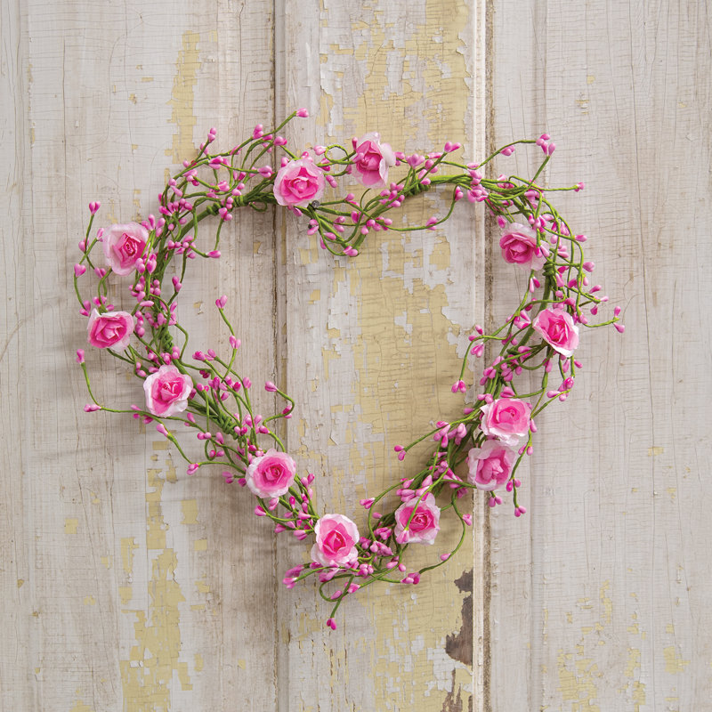 Couronne de roses et de baies roses